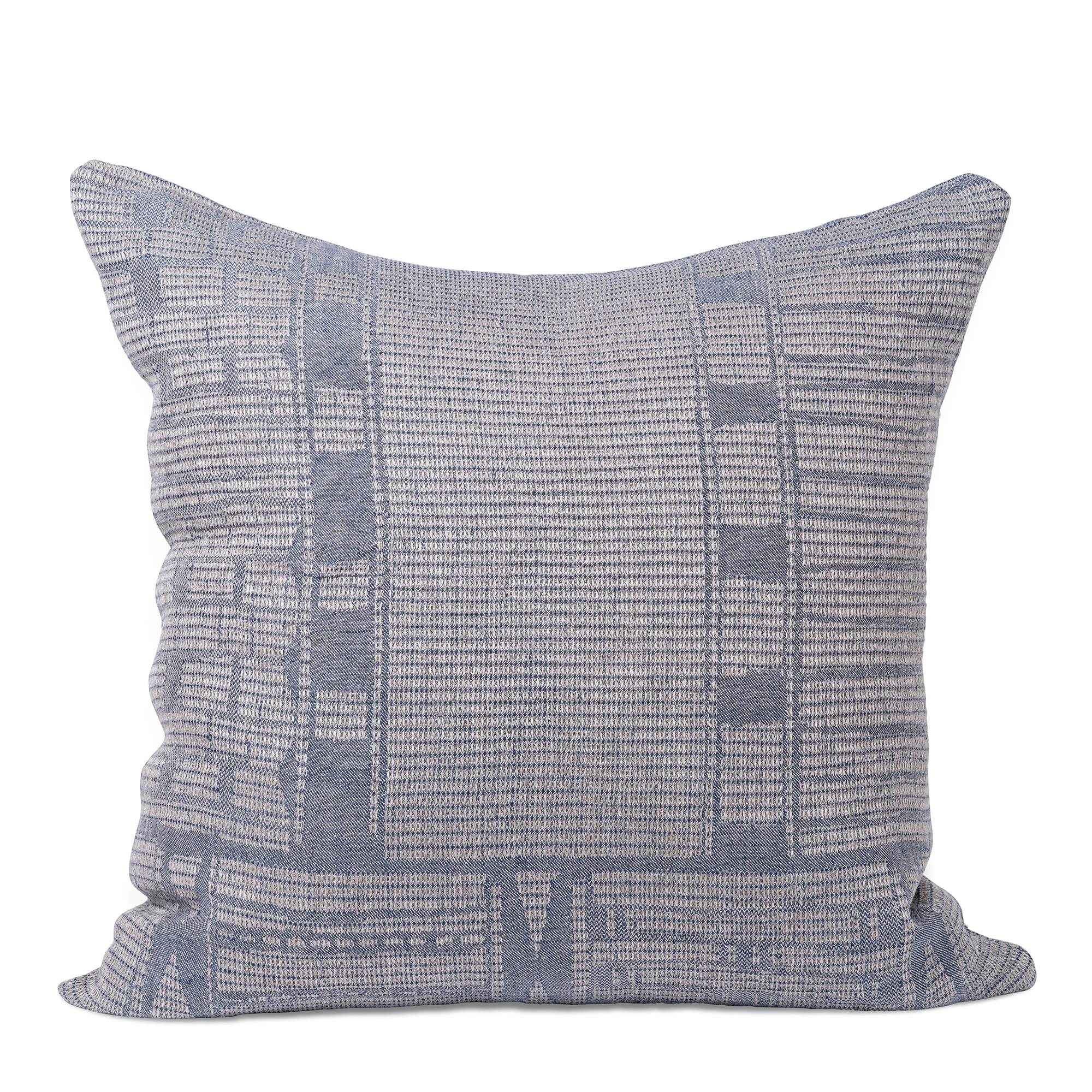 A square cushion cover features a detailed woven pattern in shades of indigo and light gray. The design includes geometric shapes and intricate textures, giving it a modern yet artisanal look.