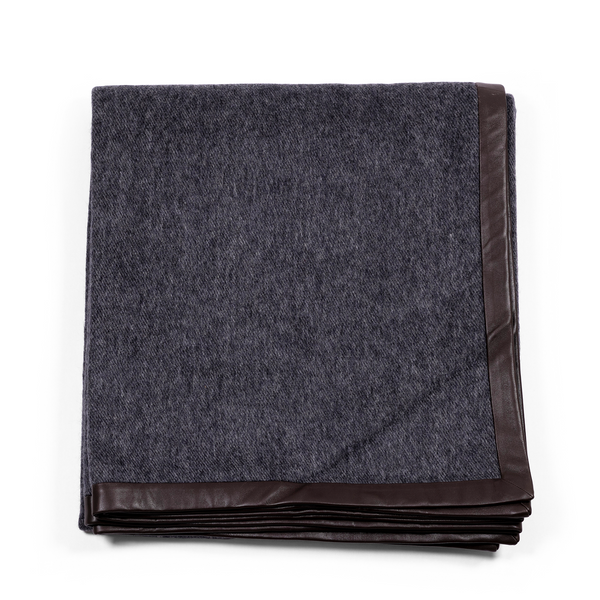 Luxurious and soft black throw, made of cashmere, with exquisite black suede edges.