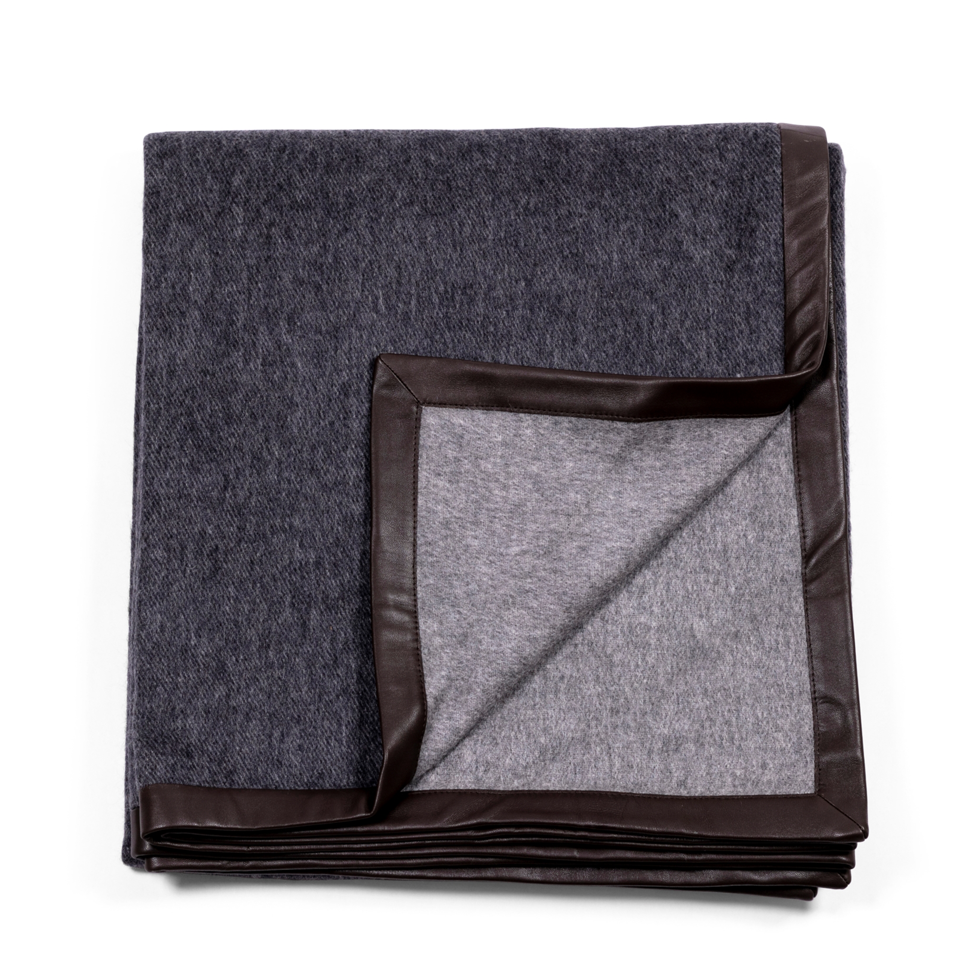 Luxurious and soft black throw, made of cashmere, with exquisite black suede edges, revealing grey back side.