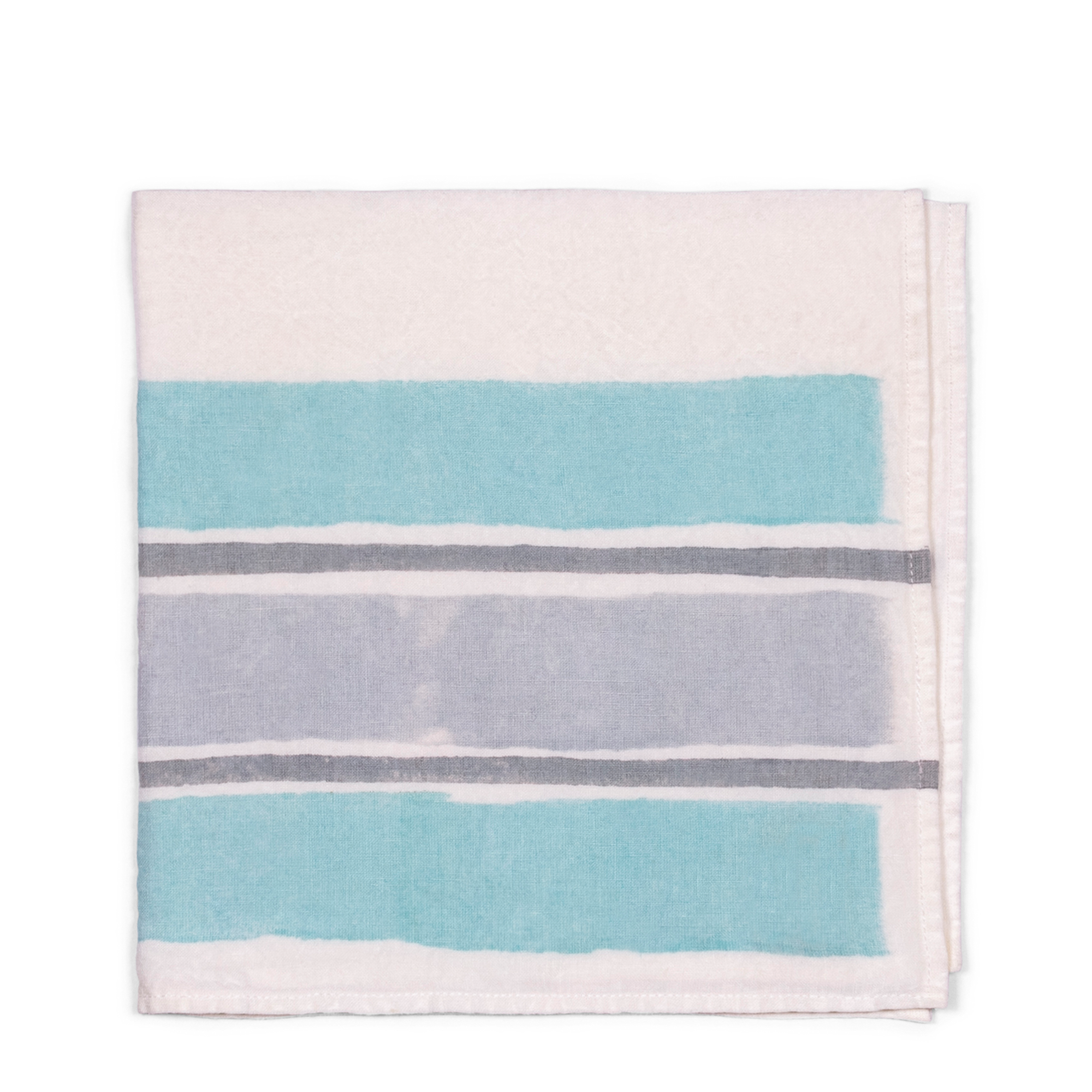 A 100% linen white napkin, with blue and grey stripes, handmade of pear wood. Perfect for breakfast, formal dining, or a garden tablescape.