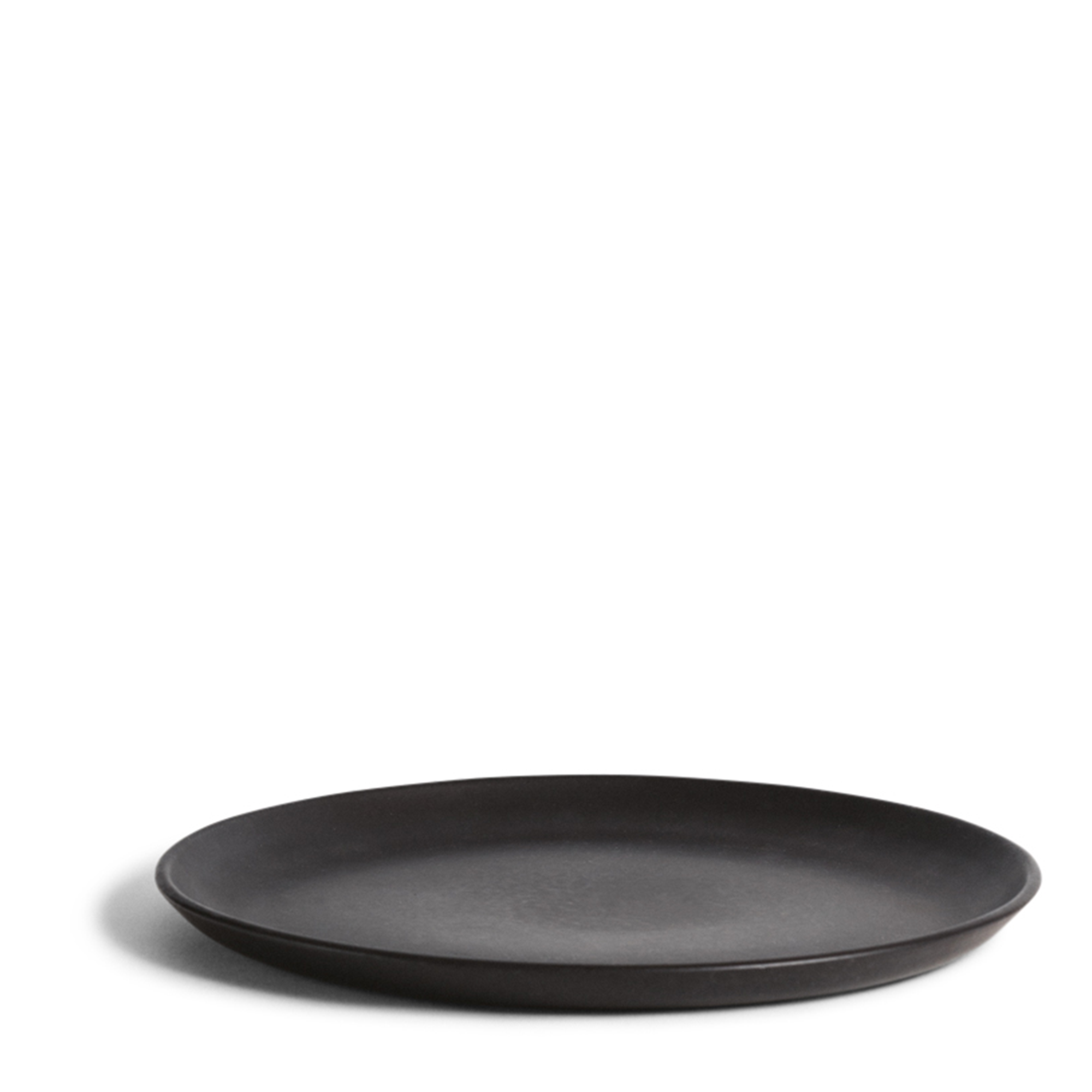 Black stoneware flat dinner plate, perfect for serving main courses or appetizers. Sleek design, ideal for both everyday use and special occasions.