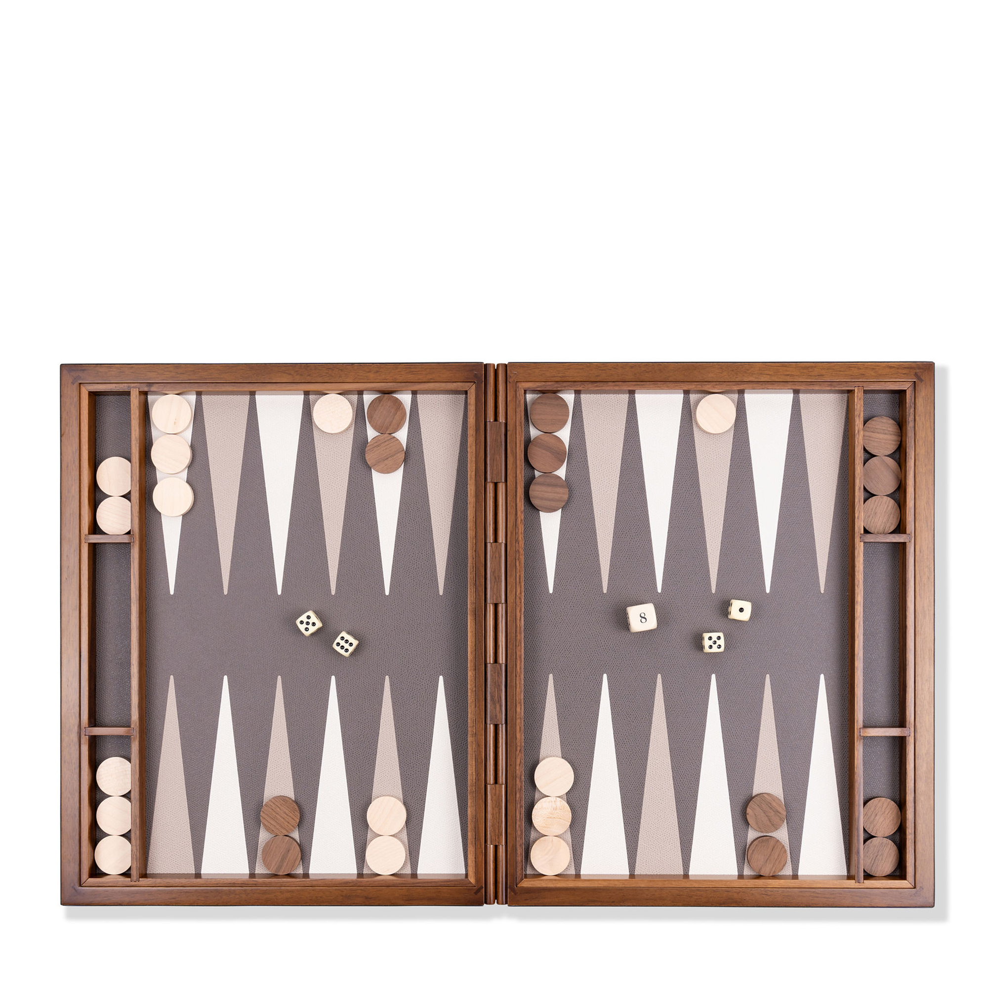 This luxurious backgammon set, covered in supple calfskin leather, features striking colors for a classic yet contemporary look. Perfect for display and play, it comes with a suede case for stylish storage. Brown, white, beige, and smoke details.