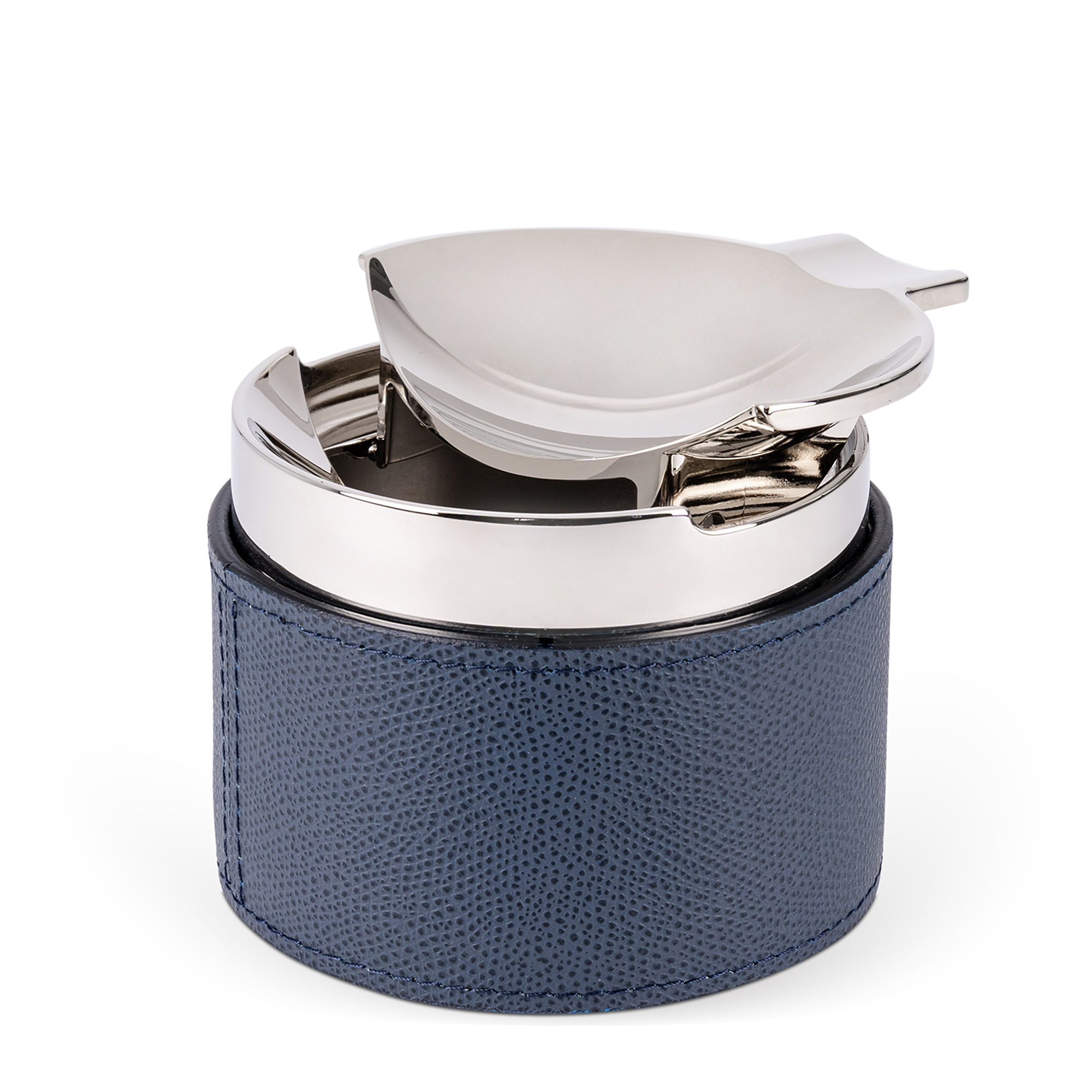 This sleek, cylindrical ashtray features a dark blue embossed leather base and a removable chrome-plated center chamber. Windproof and easy to clean, it also includes a cigar holder.