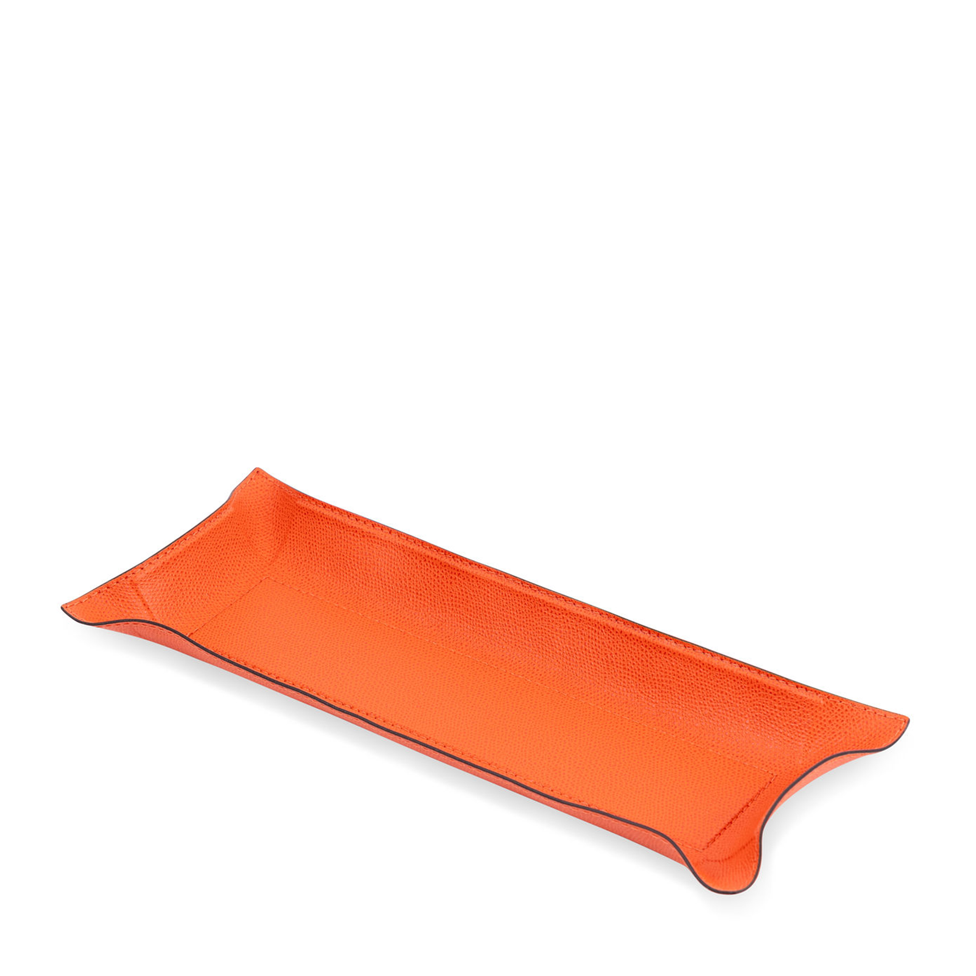 This rectangular orange tray with black borders has the hard base and flexible sides that can be adapted to your preferred arrangement. Covered in the finest calfskin, it makes a both functional and decorative piece for any space at home.