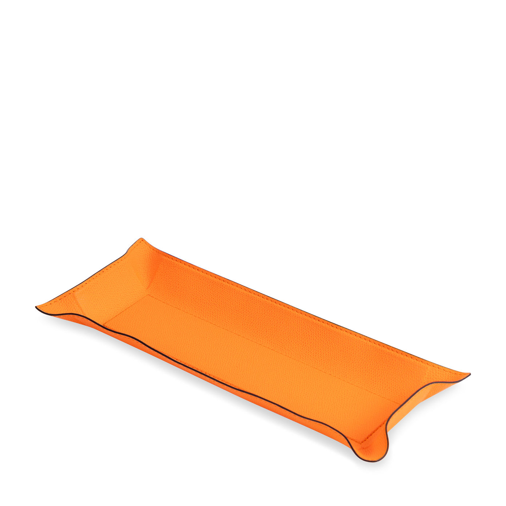 This rectangular light orange tray with black borders has the hard base and flexible sides that can be adapted to your preferred arrangement. Covered in the finest calfskin, it makes a both functional and decorative piece for any space at home.