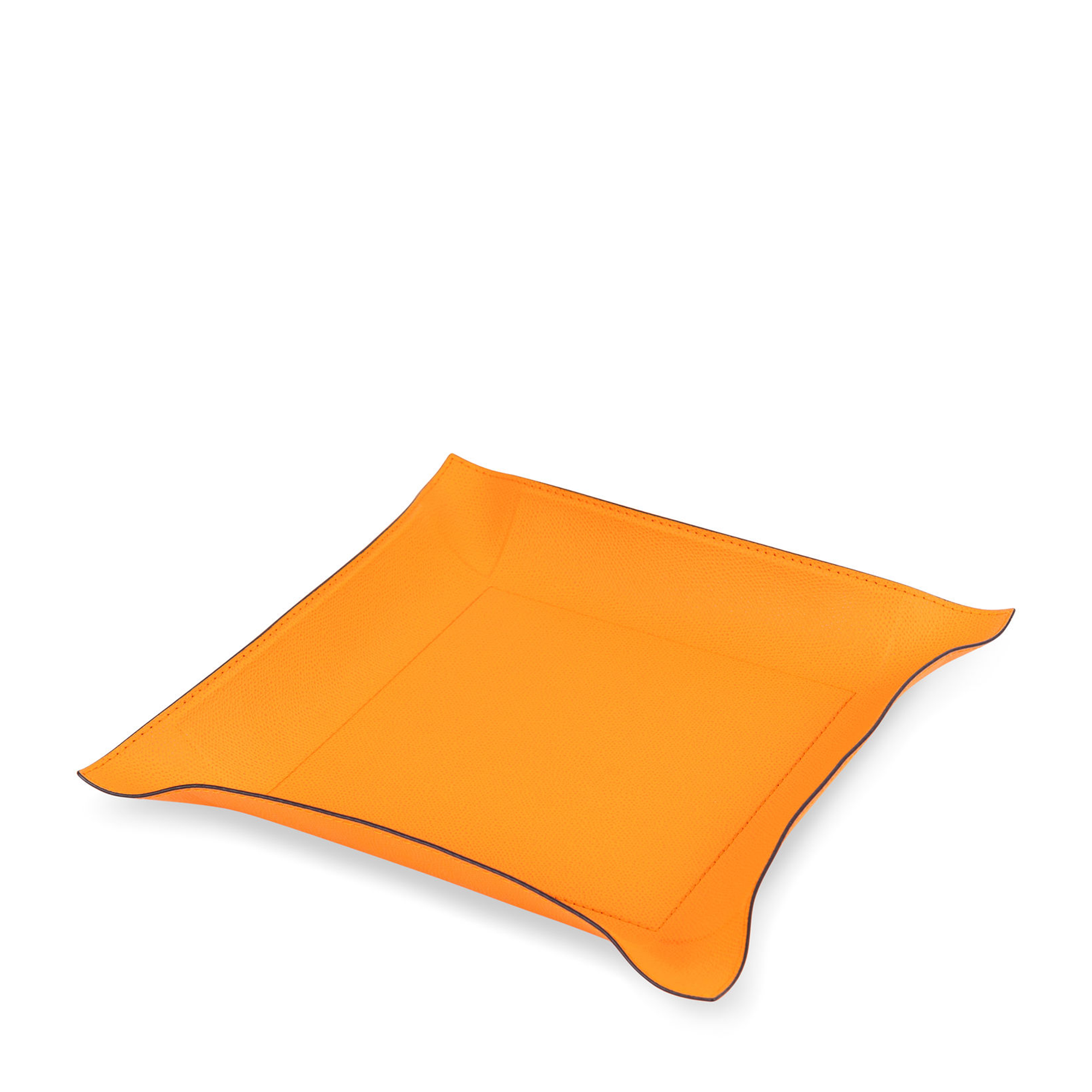 This square metal valet tray, covered in embossed calfskin light-orange leather with black borders. Its moldable sides and durable, water- and scratch-proof leather make it perfect for use on a desk, kitchen counter, side table, or foyer.