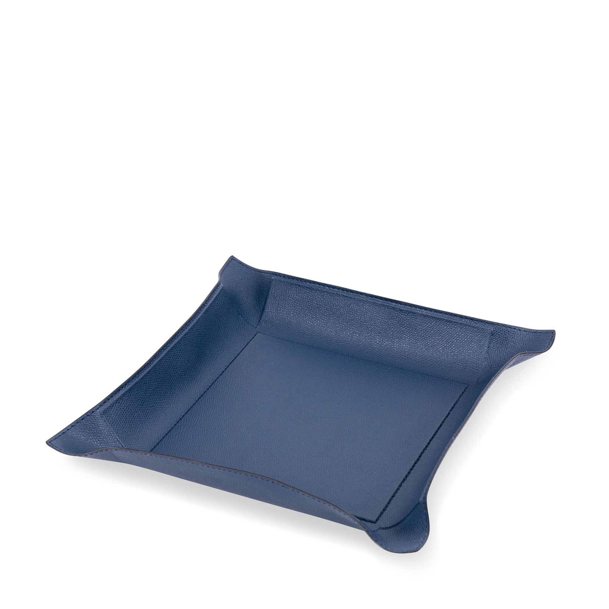This dark blue square tray has the hard base and flexible sides that can be adapted to your preferred arrangement, and covered in the finest calfskin makes a both functional and decorative piece for any space at home.