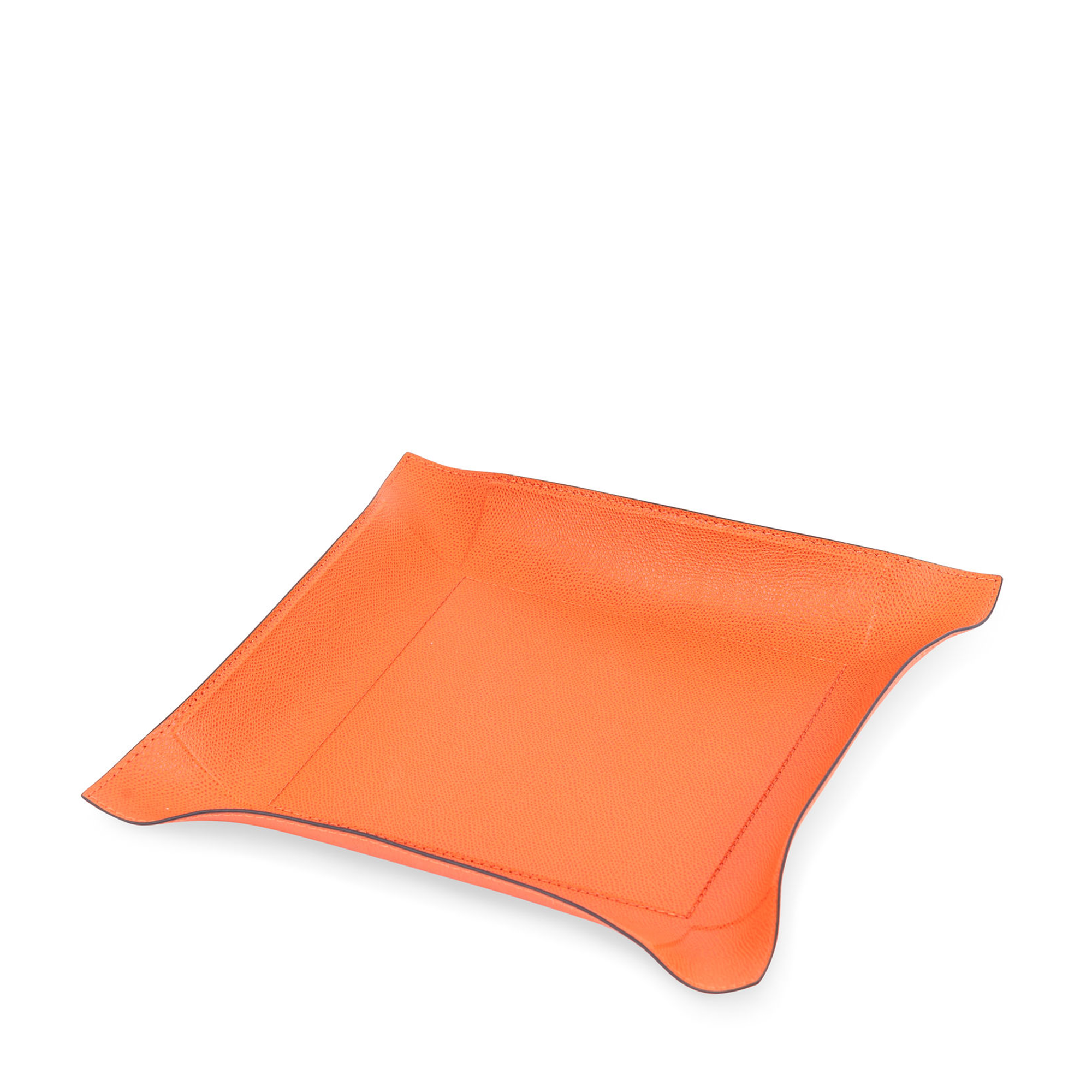 This square metal valet tray, covered in embossed calfskin orange leather with black borders. Its moldable sides and durable, water- and scratch-proof leather make it perfect for use on a desk, kitchen counter, side table, or foyer.