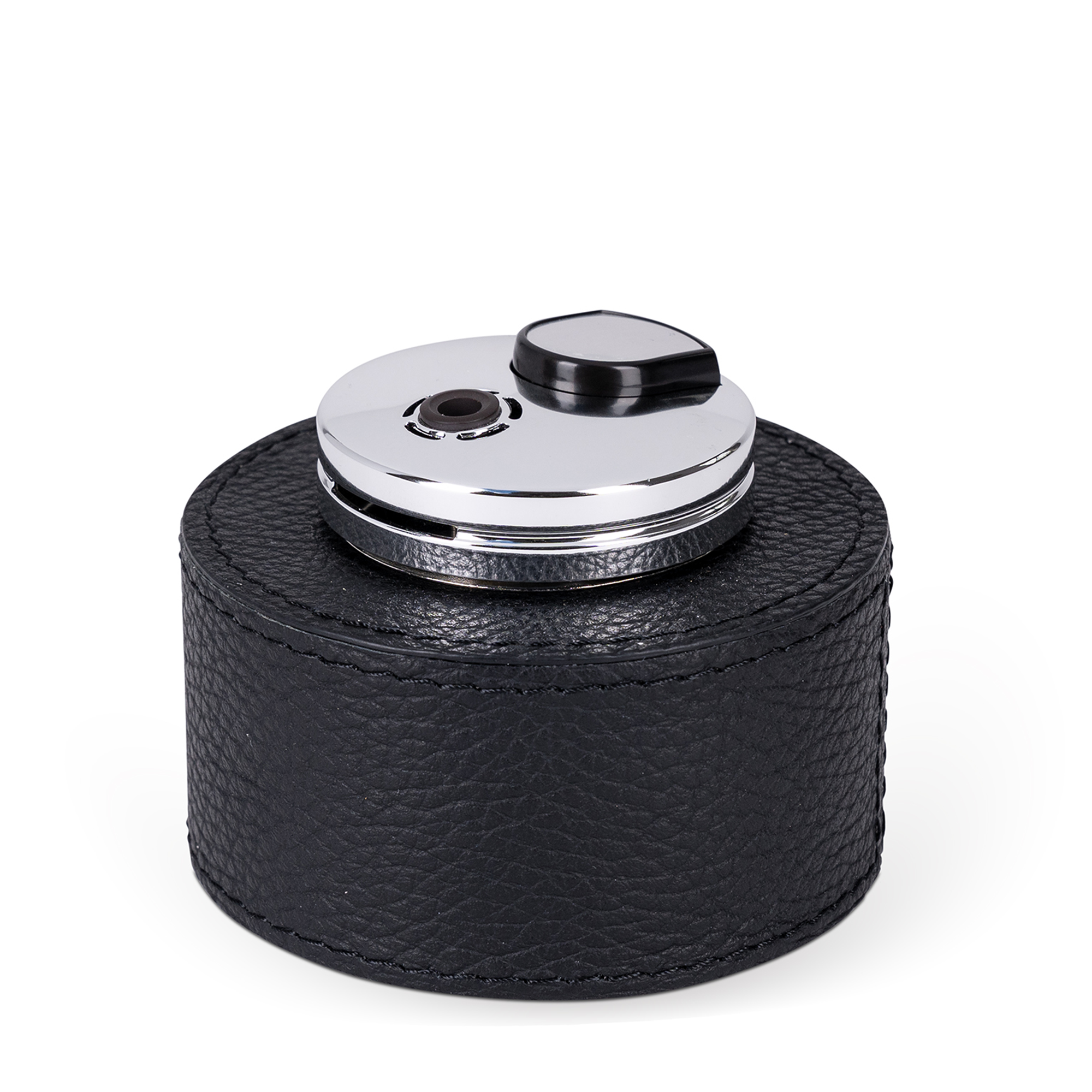 This table lighter features a handcrafted rounded wood base, luxuriously covered in black calfskin, offering an expressive texture.
