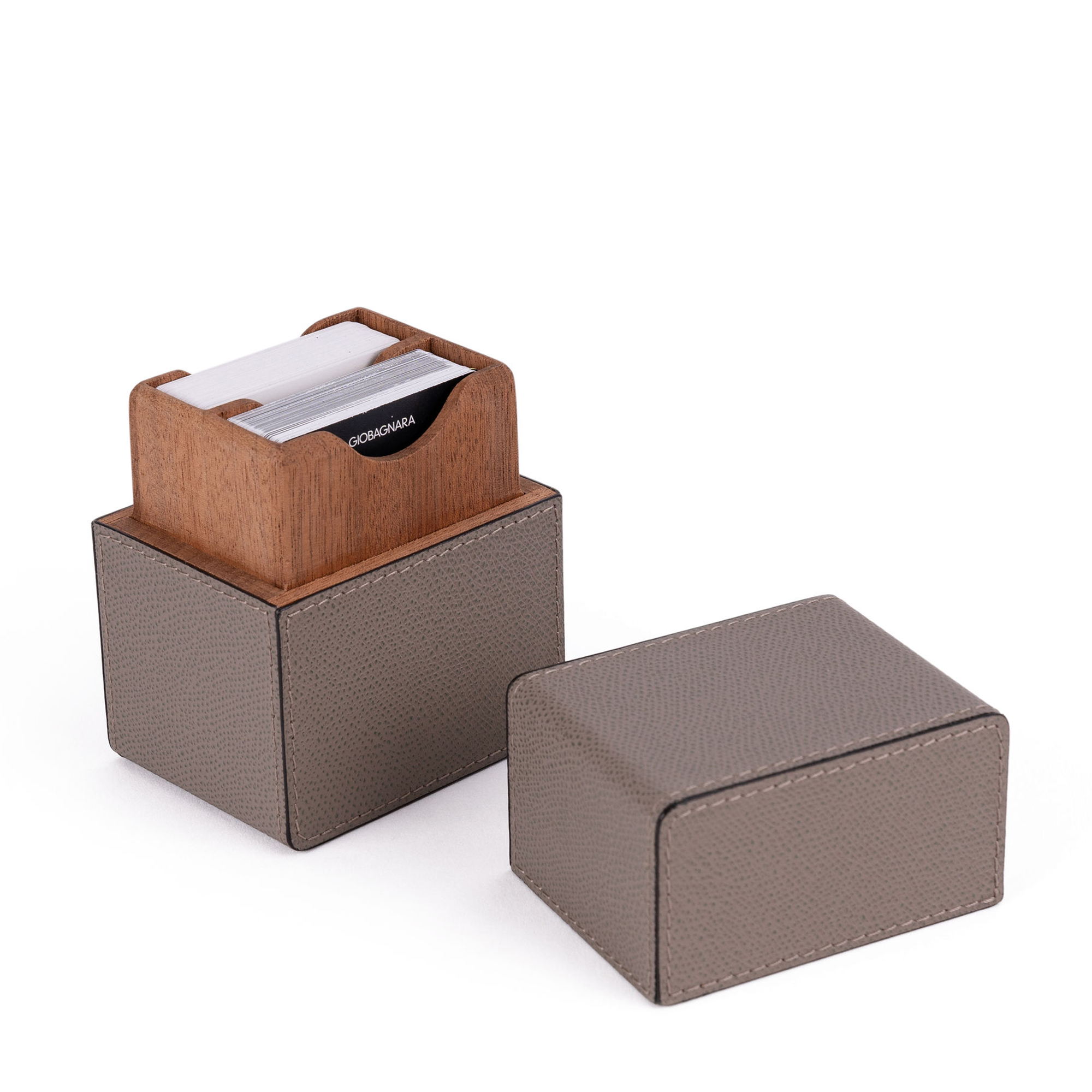 Handcrafted by expert Italian artisans, this stunning grey card set includes two decks of playing cards housed in an elegant cedar wood and calfskin leather case.