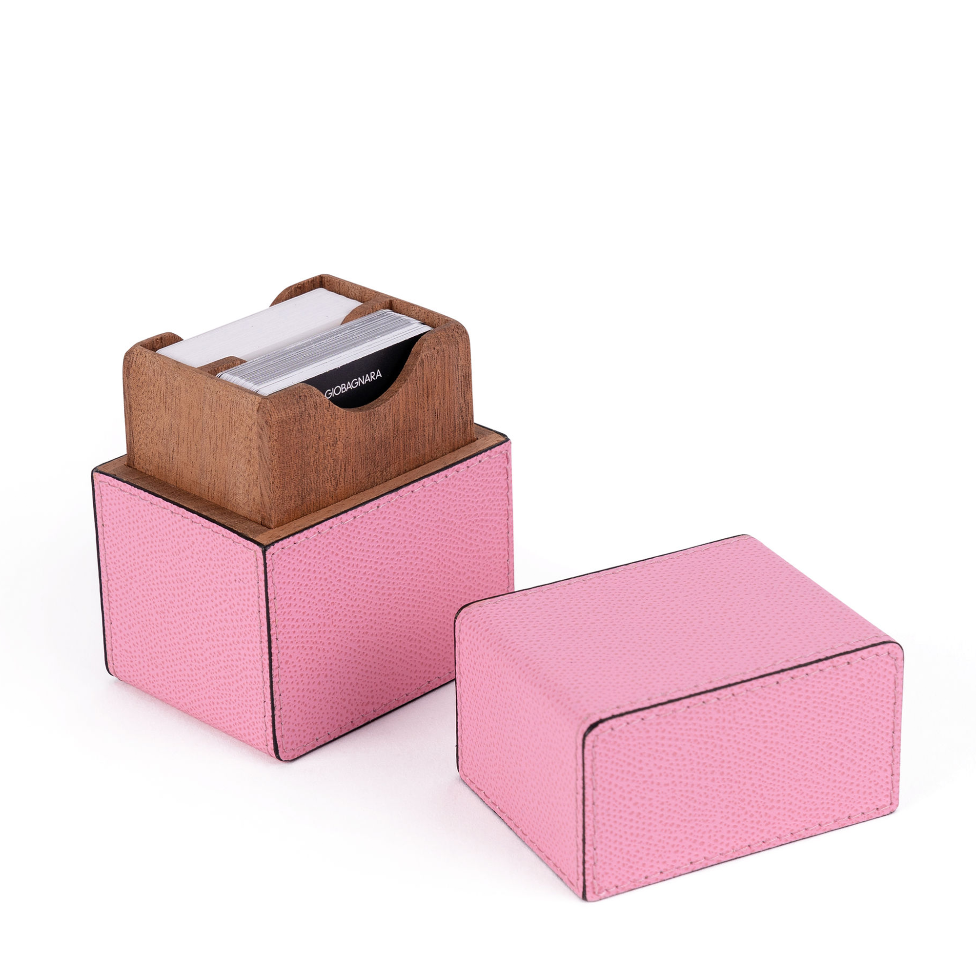 Handcrafted by expert Italian artisans, this stunning pink card set includes two decks of playing cards housed in an elegant cedar wood and calfskin leather case.