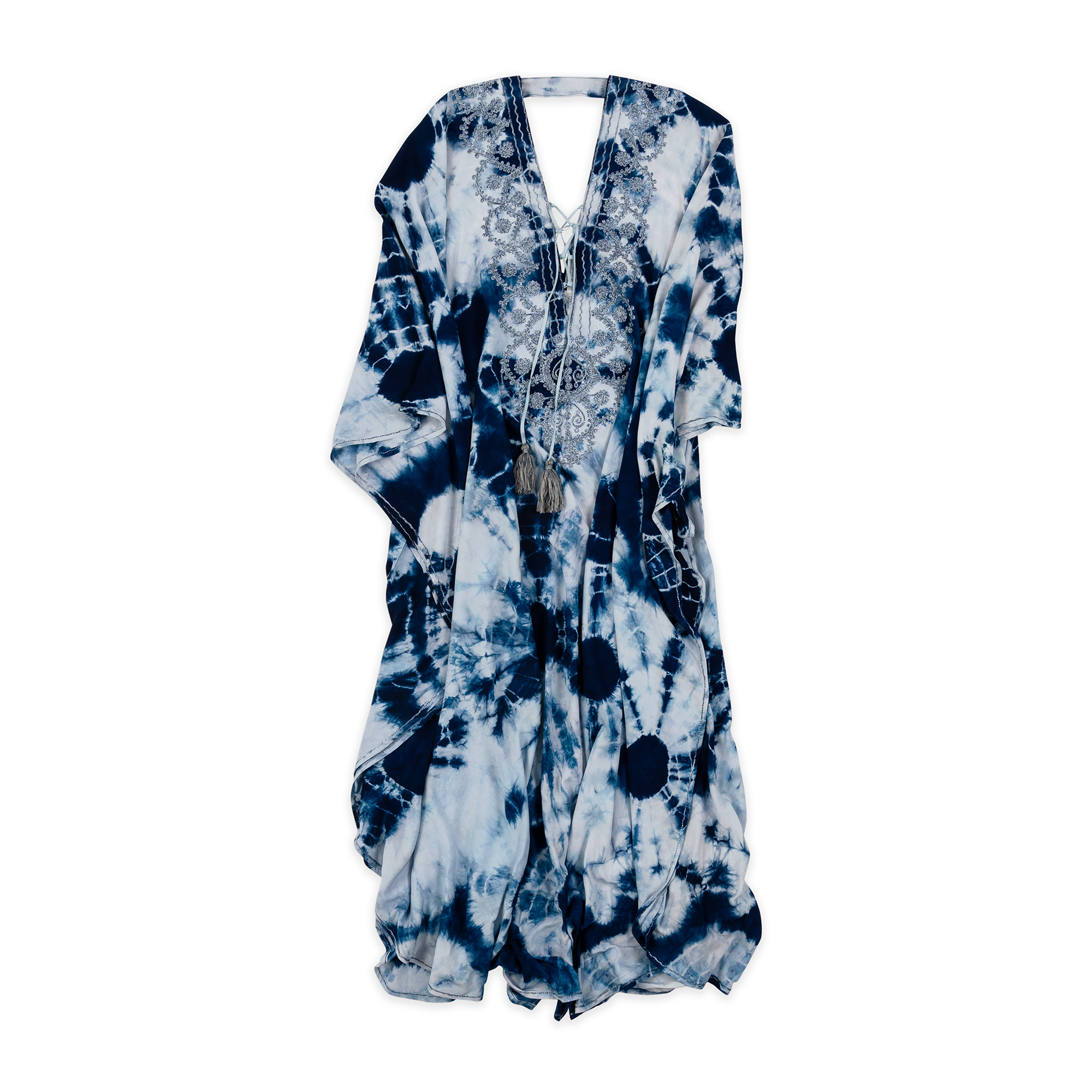 A vibrant navy and white tie-dye kaftan featuring intricate lace detailing on the neckline. The flowing, airy design provides comfort and style, making it perfect for beach outings or relaxed summer days. This elegant piece combines bohemian charm with a touch of sophistication.