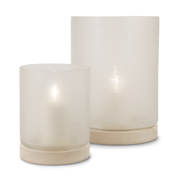 This elegant Aran Hurricane, made of glass and sycamore wood, captures attention with its simplicity and illuminates any indoor and outdoor space with soft cream hues.