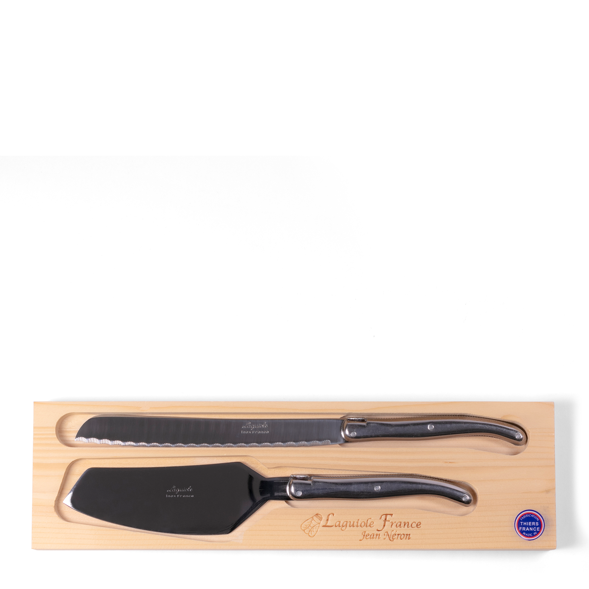 Cake + Bread Serving Set, hand-crafted in France by expert craftsmen, each utensil features a mirror finish and a sleek, stainless steel handle embossed with a bee detail.