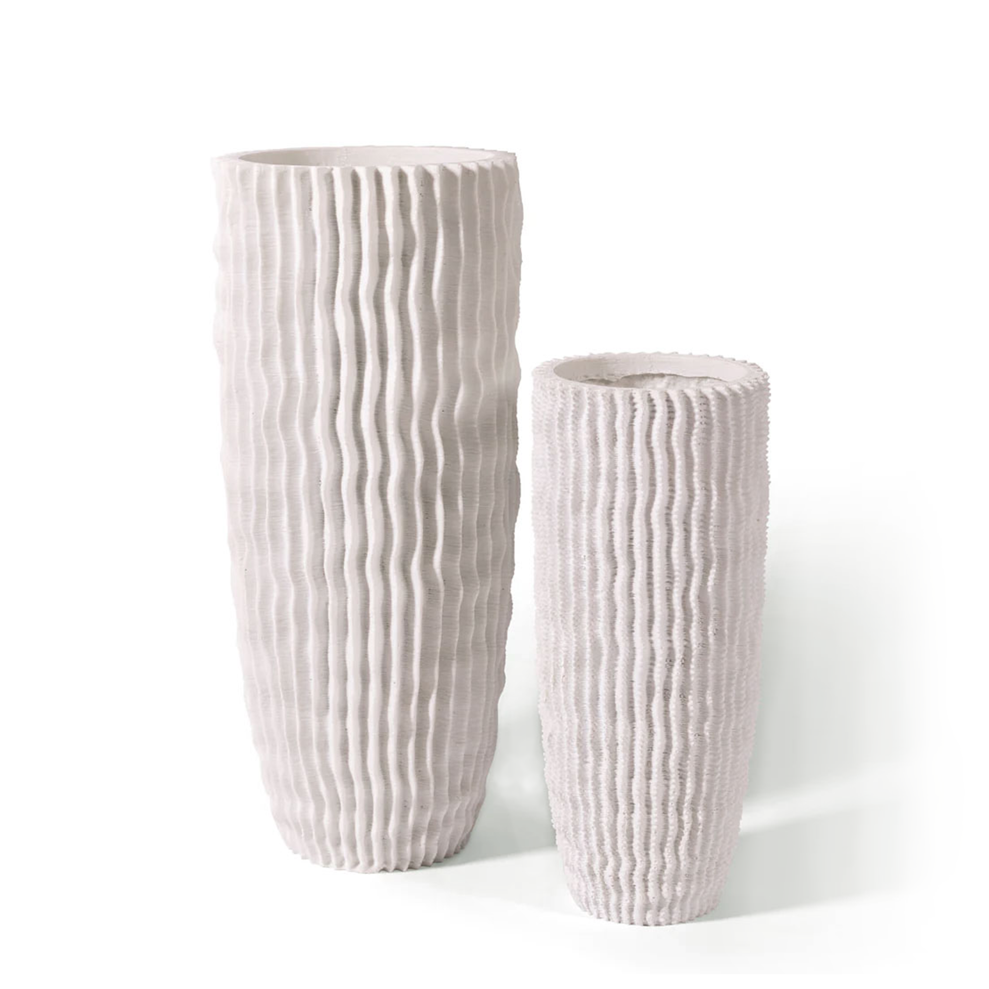 This textural white Cactus Vase is intricately designed to emulate the ridges of a cactus, handcrafted of high-quality polymer resin with natural limestone sourced from the Philippines, offering both beauty and durability.