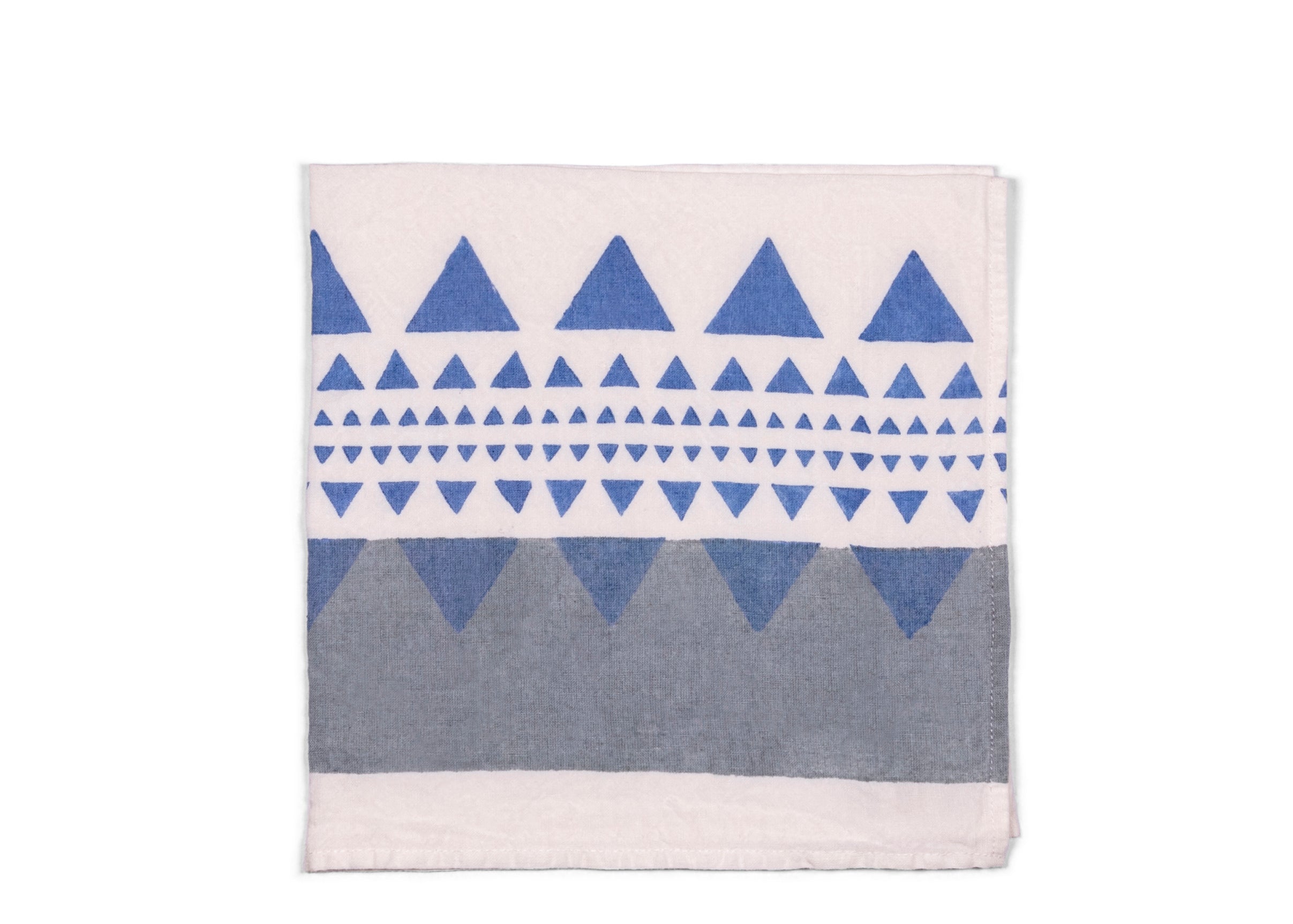 A harmonious blend of grey and blue geometric patterns on the white napkin base. The fusion of these calming hues and modern designs adds a touch of contemporary elegance to your table setting, suitable for various occasions.