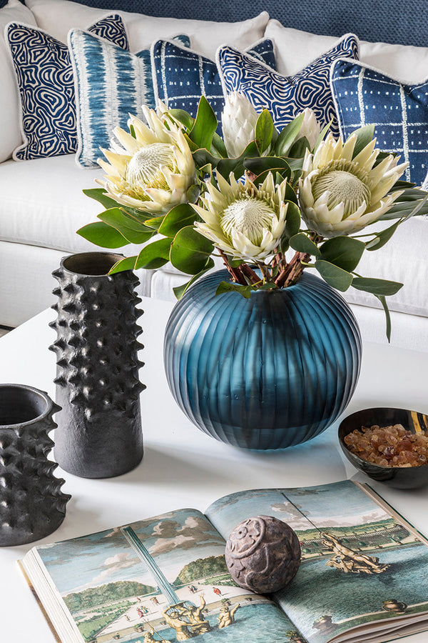 flowers in vase on coffee table