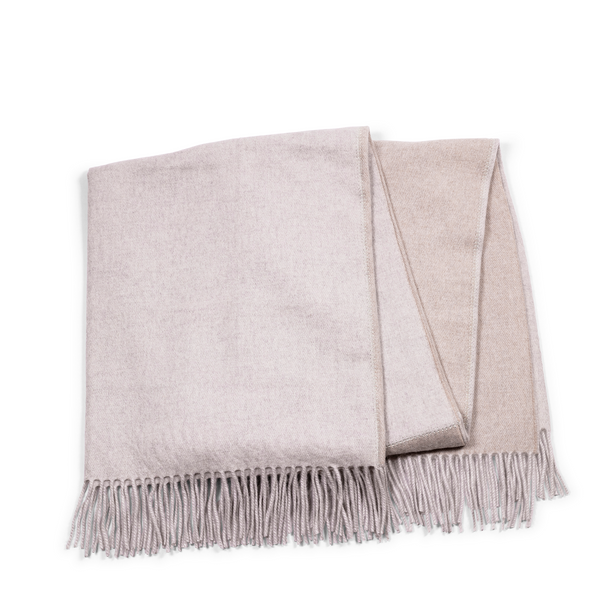 This cashmere throw fits into every home interior, with beige ivory base and soft light grey on the reverse, and making every room cozy and stylish.