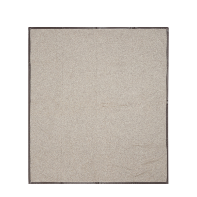 Sophisticated beige reversible throw with taupe leather edges for a luxurious look.