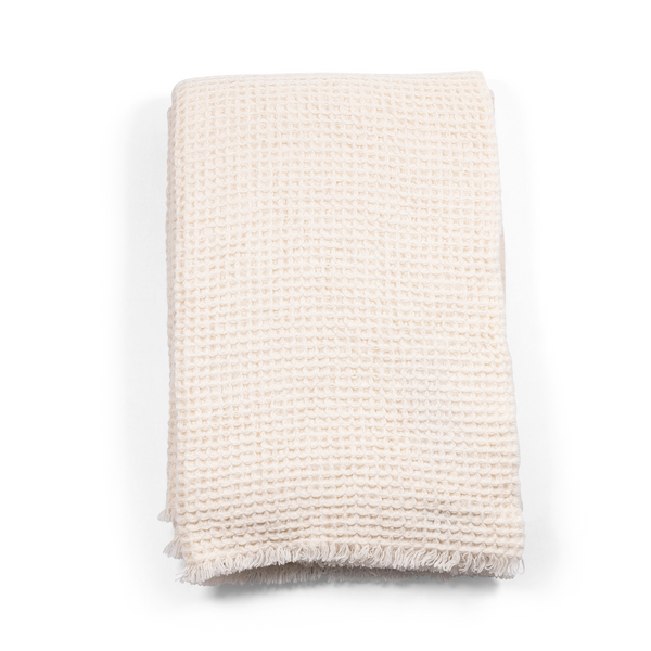 Folded Sasha Cashmere Throw Ivory, for ultimate softness and style.