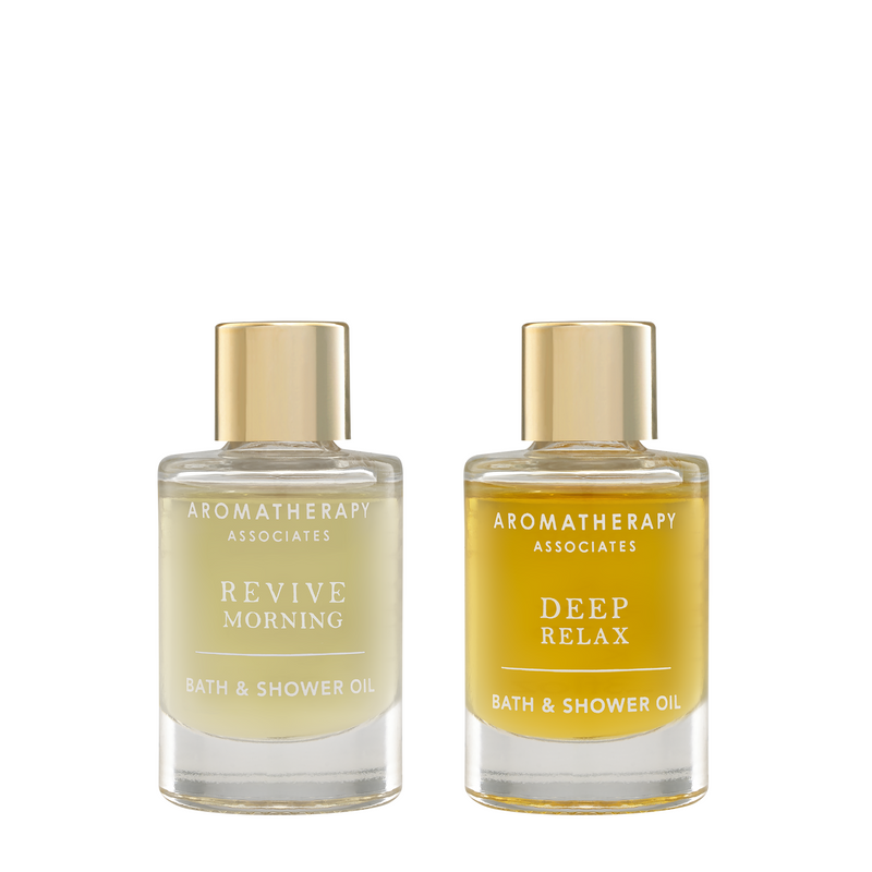 Revive Bath & Shower Oil and Deep Relax Bath & Shower Oil packed in 9 ml glass bottles.