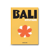 An eye catching design of Bali Mystique book cover, featuring a radiant yellow background with white and orange details, makes it a vivid decorative piece and a lovely gift.
