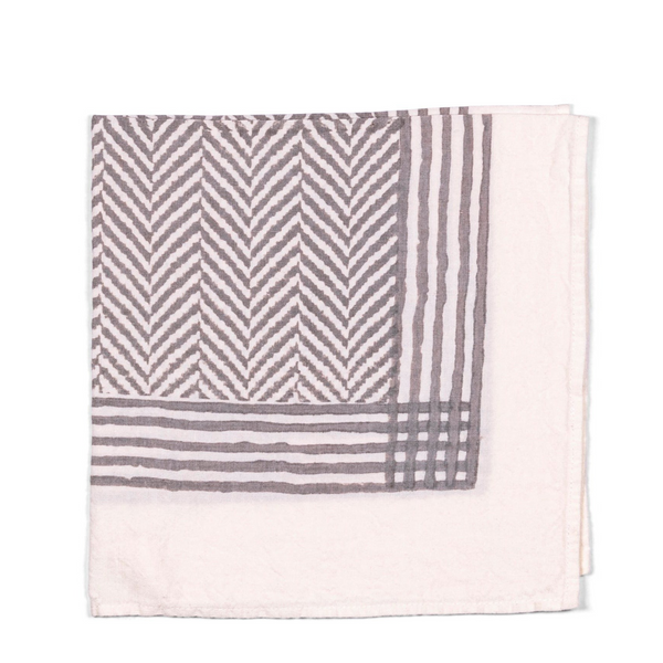 A chic and versatile addition to your table setting, this napkin blends modern design with understated sophistication. The white base and muted grey tones and chevron pattern bring a touch of contemporary style to any event or dining experience for every season.