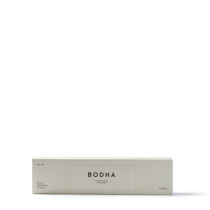 Smokeless incense sticks releasing aromatic scents, while inducing a calming effect, all without producing visible smoke. Packed in a light grey box.