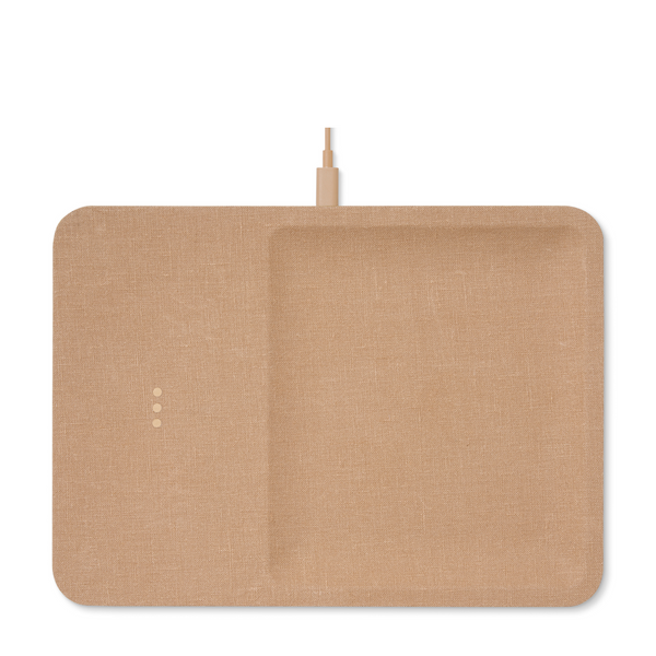 Sleek linen covered wireless charger combines functionality and elegance. This modern camel piece is a stylish addition to your office desk or any other space in your home.