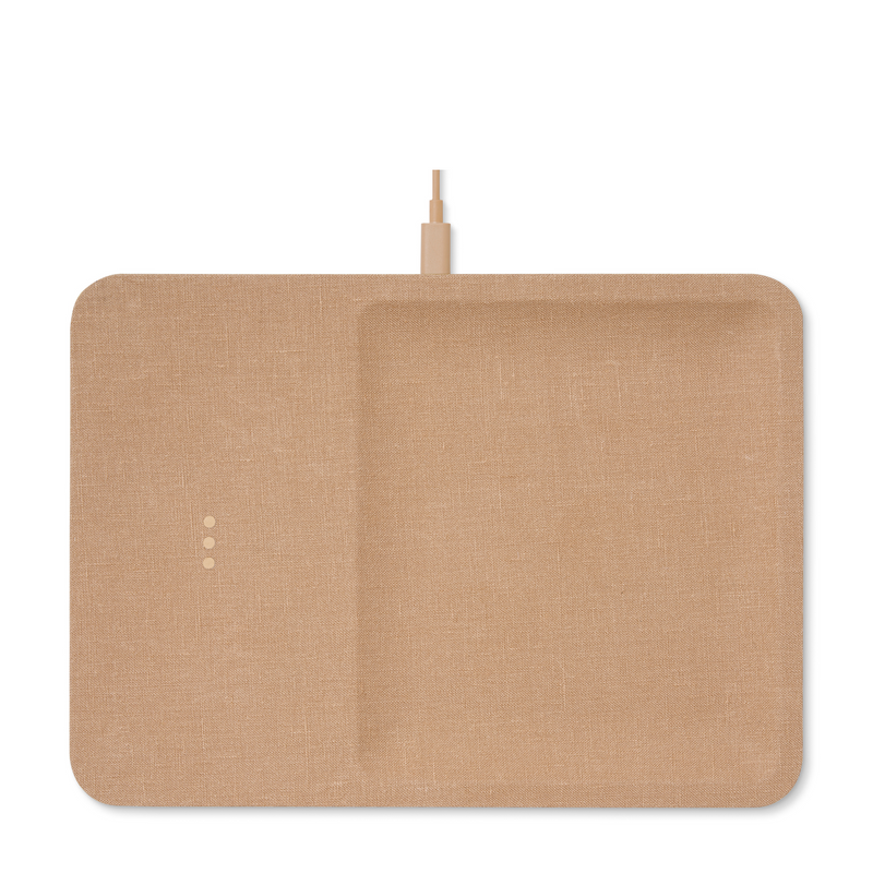 Sleek linen covered wireless charger combines functionality and elegance. This modern camel piece is a stylish addition to your office desk or any other space in your home.
