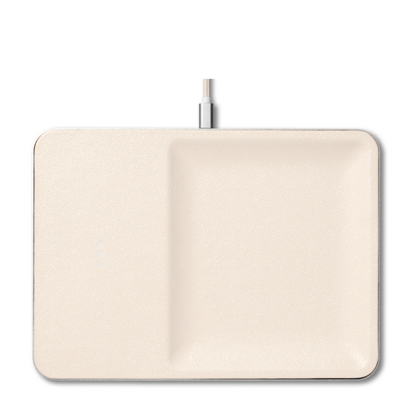 Sleek leather covered wireless charger combines functionality and elegance. This modern ivory piece is a stylish addition to your office desk or any other space in your home.