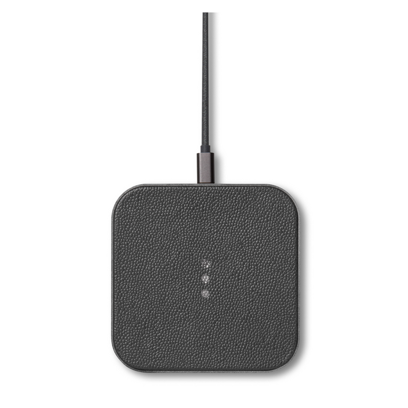 Sleek leather covered wireless charger combines functionality and elegance. This modern dark grey piece is a stylish addition to your office desk or any other space in your home.