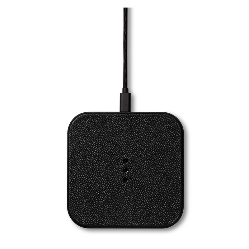 Sleek leather covered wireless charger combines functionality and elegance. This modern black piece is a stylish addition to your office desk or any other space in your home.