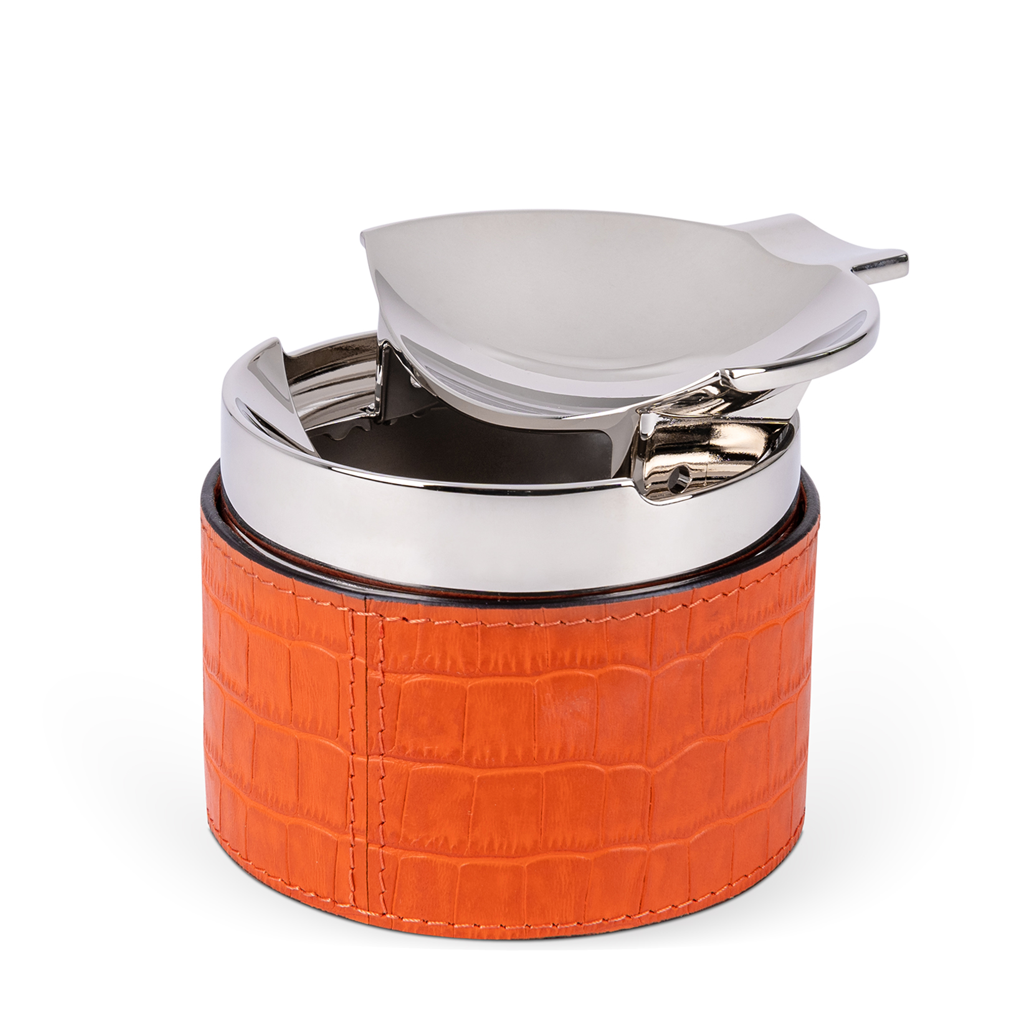 This sleek, cylindrical ashtray features an orange croc-embossed leather base and a removable chrome-plated center chamber. Windproof and easy to clean, it also includes a cigar holder, making it a great gift for cigar or cigarette enthusiasts.