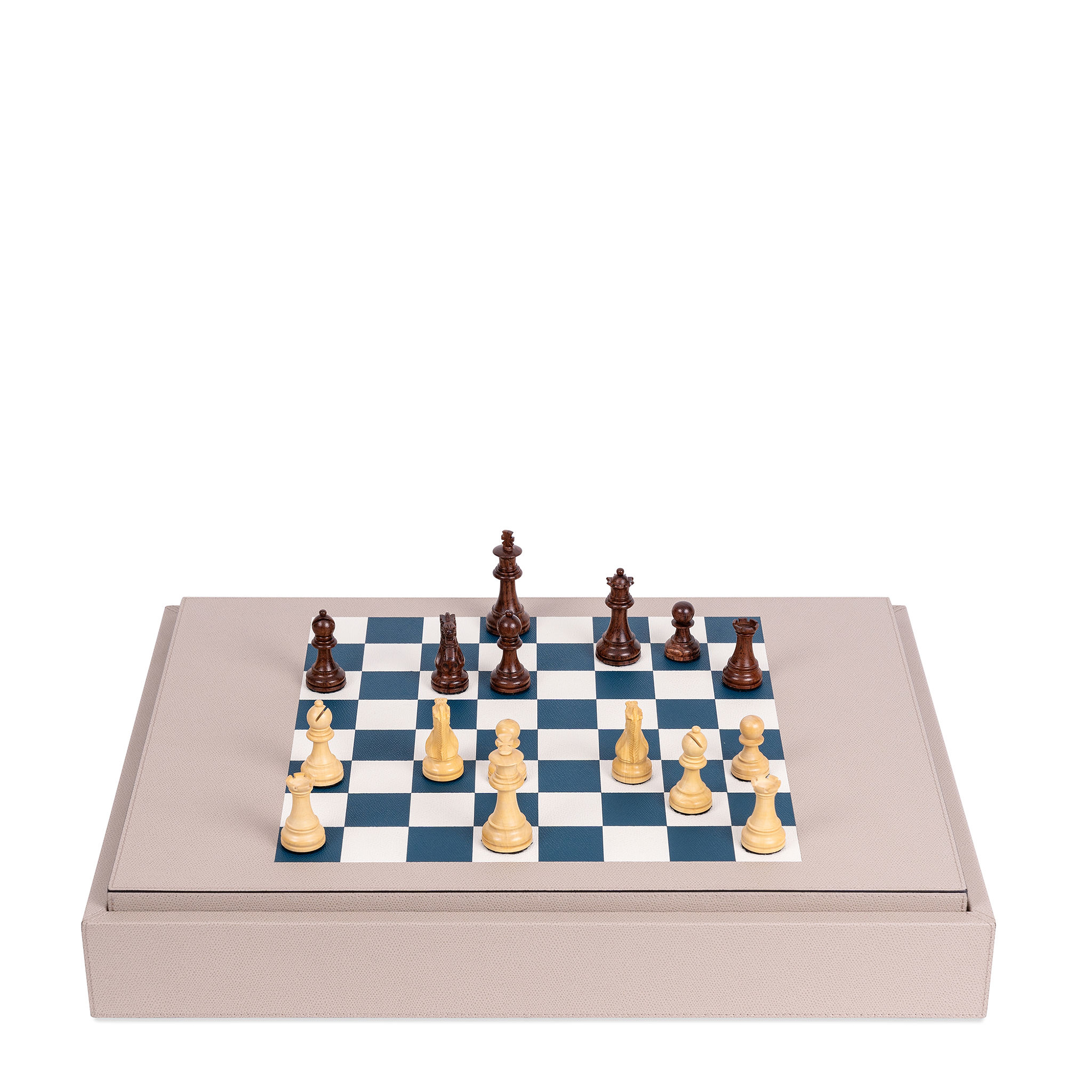 This leather-covered wooden game, it features a reversible board with four games—chess, dominos, checkers, and backgammon—and includes game pieces in suede pouches, dice, and two decks of cards. 