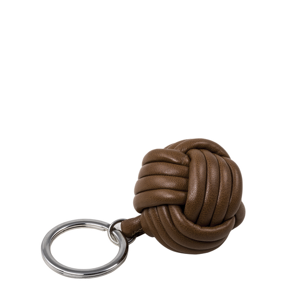 Handcrafted from exquisite nappa brown leather by skilled artisans, it adds a classic elegance to your keyring.