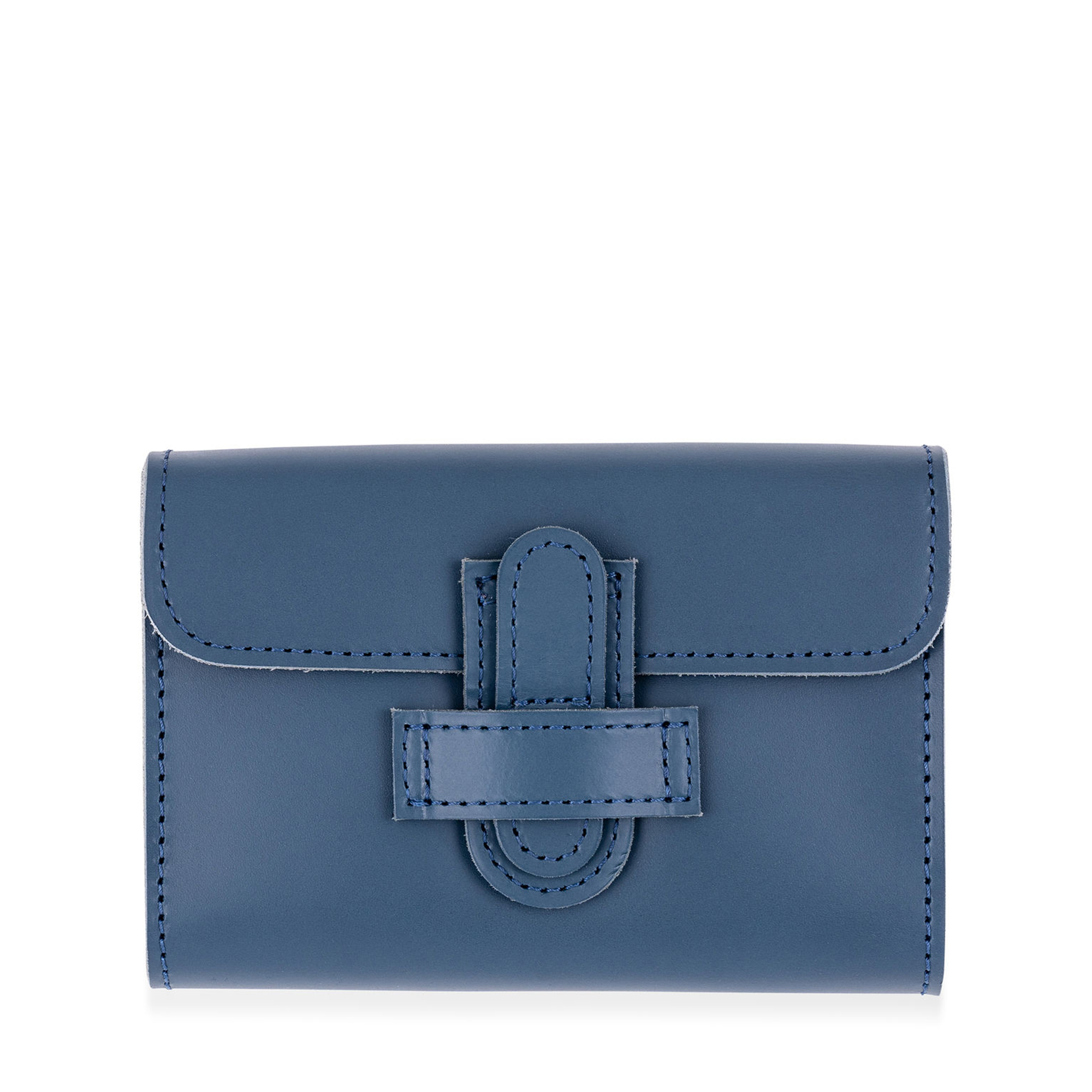 This handmade navy card holder is durable yet soft, crafted from saddle leather. It includes two sets of playing cards and a scoring pad, secured with a tab and loop closure.