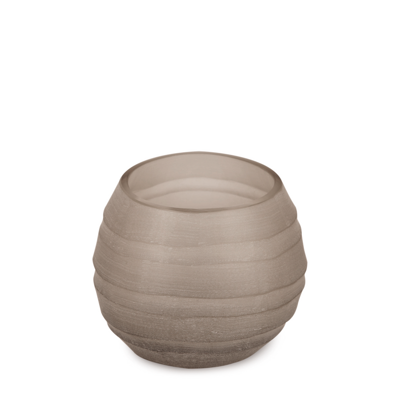 The soft smokey hue casts warm shadows and playing with expressive texture, this handmade glass vase adds a touch of affection and elegance to any interior or exterior place.