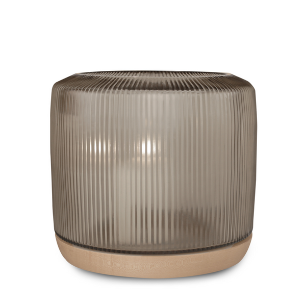 This elegant San Francisco Hurricane, made of pleated glass and organic walnut wood, captures attention with its rounded shape and expressive texture, bringing warm atmosphere into any indoor and outdoor space.