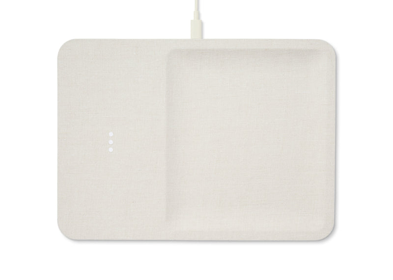 Sleek linen covered wireless charger combines functionality and elegance. This modern off white piece is a stylish addition to your office desk or any other space in your home.