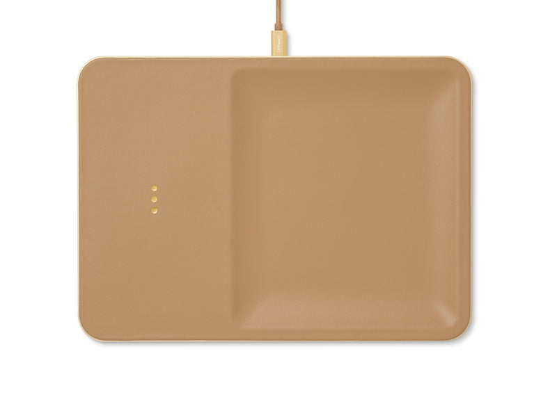 Sleek leather covered wireless charger combines functionality and elegance. This modern cortado piece is a stylish addition to your office desk or any other space in your home.