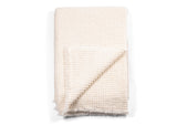 Folded Sasha Cashmere Throw Ivory, revealing the same reverse.