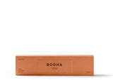 Smokeless incense sticks releasing aromatic scents, while inducing a mind clearing effect, all without producing visible smoke. Packed in a warm burnt orange box. 