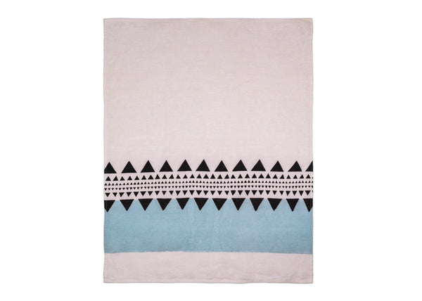 Unfolded tea towel featuring a white base adorned with modern light blue and black geometric elements.