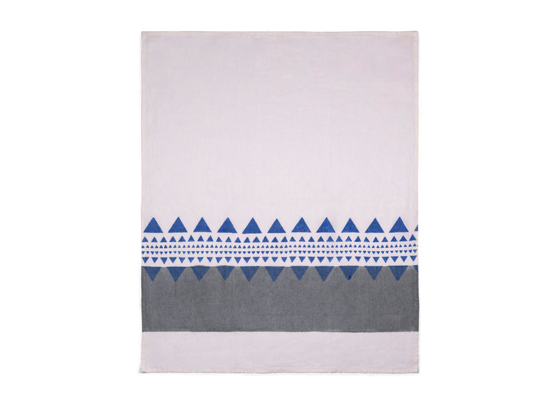 Unfolded tea towel brings contemporary charm featuring a white backdrop, subtle grey stripe and a captivating blue geometric pattern.