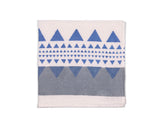 A harmonious blend of grey and blue geometric patterns on the white napkin base. The fusion of these calming hues and modern designs adds a touch of contemporary elegance to your table setting, suitable for various occasions.
