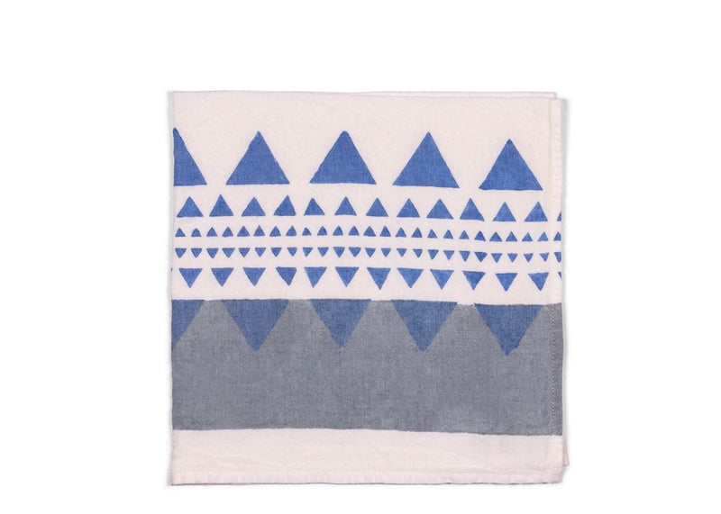 A harmonious blend of grey and blue geometric patterns on the white napkin base. The fusion of these calming hues and modern designs adds a touch of contemporary elegance to your table setting, suitable for various occasions.