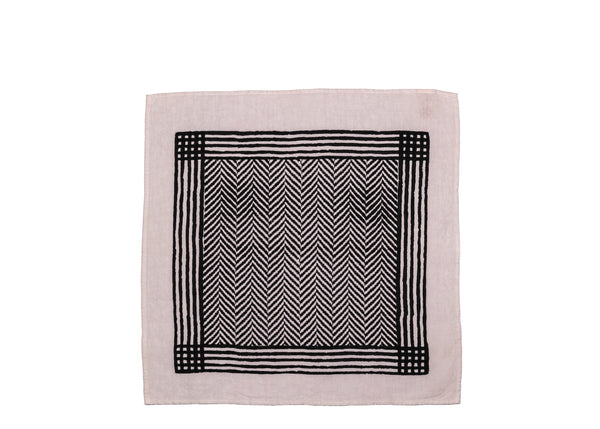 Unfolded white base napkin with a black chevron pattern that creates a visually striking effect, perfect for both formal occasions and casual gatherings.