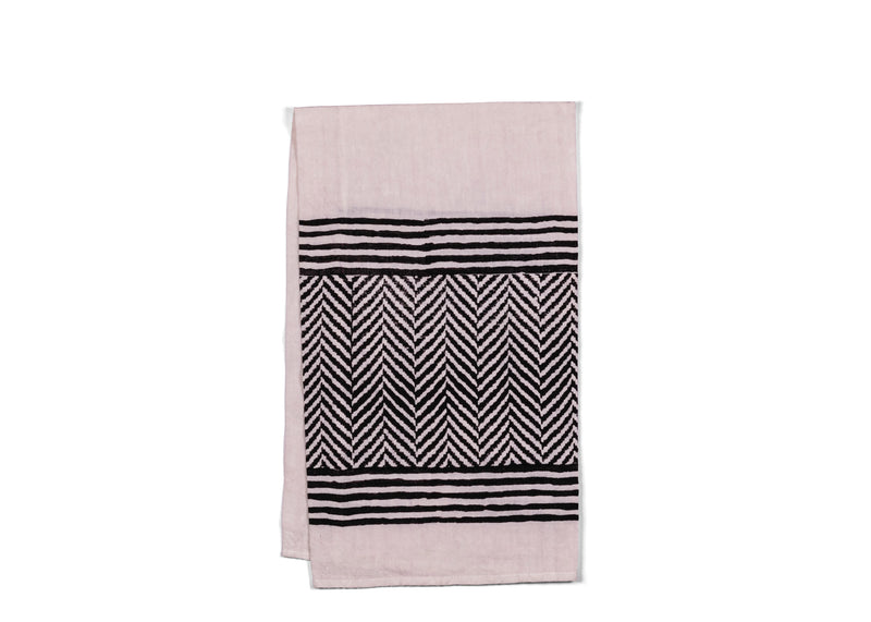  A chic and functional addition to your kitchen and table, the black chevron tea towel combines style and practicality.