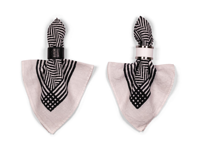 Black Chevron Napkins with black and white leather napkin rings, as a perfect addition to a simple yet elegant table setting.
